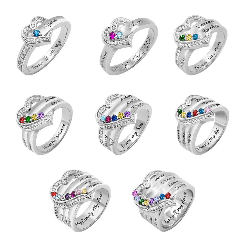 Collection of personalized sterling silver rings with engraved names and birthstones, ideal for family gifts.