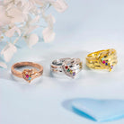 Elegant rose gold, silver, and gold family birthstone rings with heart designs and personalized engravings.