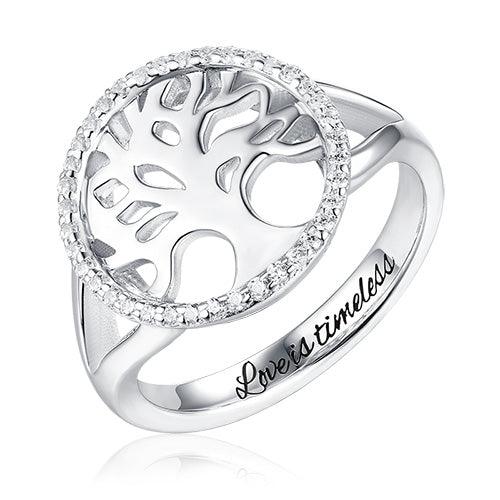 Silver ring with a tree design, encrusted with small diamonds, and "Love is timeless" inscription.