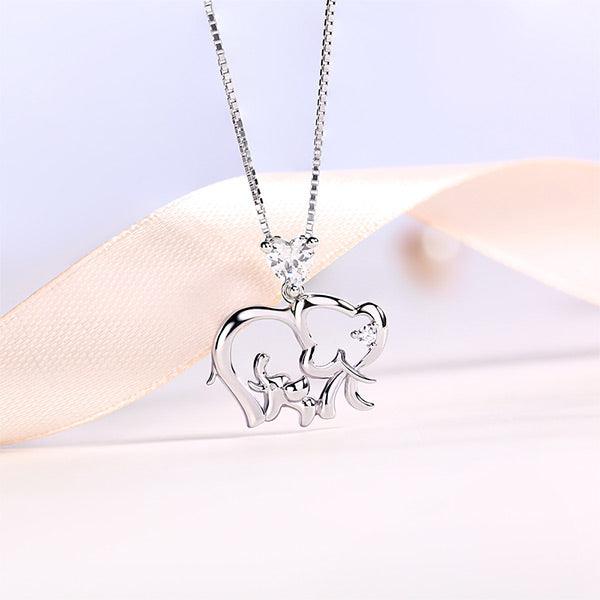 Elegant sterling silver necklace featuring a baby and mother elephant design with a personalized birthstone heart pendant, symbolizing maternal love and protection.