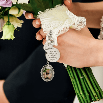 Bride holding a bouquet with a bridal photo charm and a message for grandma.