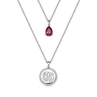 Double-layered necklace in sterling silver with a teardrop birthstone pendant and CZ monogram pendant, perfect for personalized gifts and special occasions.