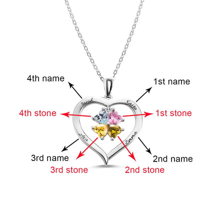 A heart-shaped silver necklace with four heart-shaped birthstones, marked to indicate the first, second, third, and fourth stones and engraved names "Jacob," "Katira," "Ayla," and "Emma."