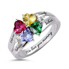 Silver ring with four heart-shaped multicolored gems and engraved names "Olivia," "Rebecca," "Sandy," "Joshua" with "We love you mommy."