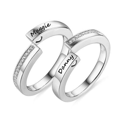 Personalized Infinity Couple Rings Set in sterling silver with custom engraved names, Maggie and Danny. Elegant design with embedded stones, symbolizing eternal love.