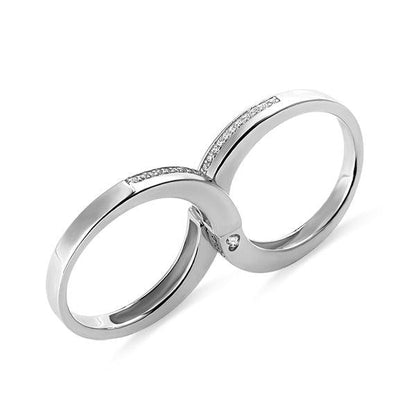 Sterling silver couple rings set forming an infinity symbol when joined, with embedded stones. Elegant design representing eternal love and unity.