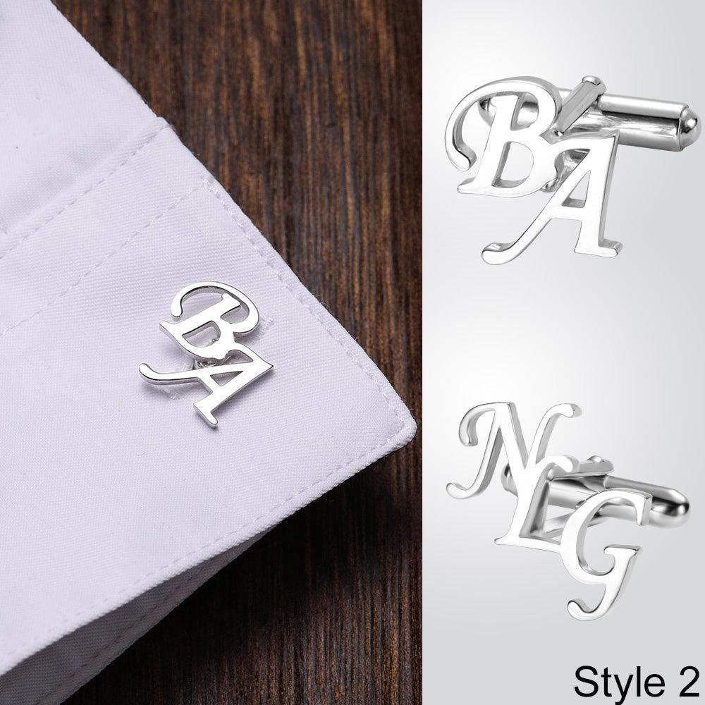 Silver 'BA' cufflink on shirt cuff and 'NG' cufflink, titled 'Style 2', against a wood backdrop.