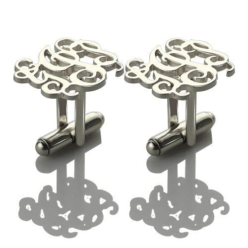 Silver monogram cufflinks with elegant looping script design on a white background.