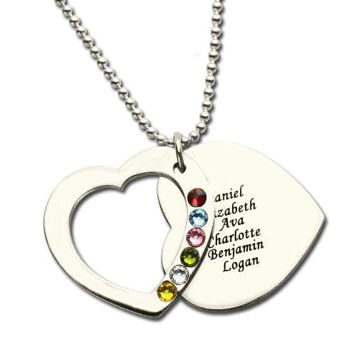 Silver heart pendant with cutout, engraved names, and multicolored gems on a chain.