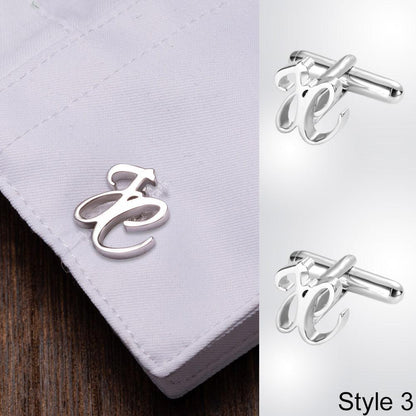 JC initial cufflinks on white shirt cuff, displayed alongside Style 3 cufflinks on a wooden surface.