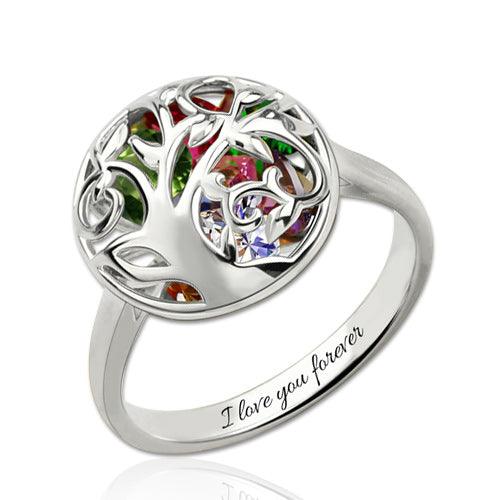 A silver ring with a tree of life design featuring multicolored gemstones. The inside of the band is engraved with the words "I love you forever."