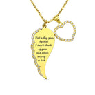 Gold pendant necklace with a wing-shaped charm and a heart encrusted with rhinestones, featuring a poignant quote