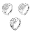 Three silver rings with engraved designs: "CNA," "RN," "MD," caduceus symbols, "2021," "667," "Laura," "Sara," "Kim," and phrases like "Healing hands," "With a caring heart," and "Love and care.